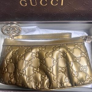 Gucci Gold Clutch Wristlet